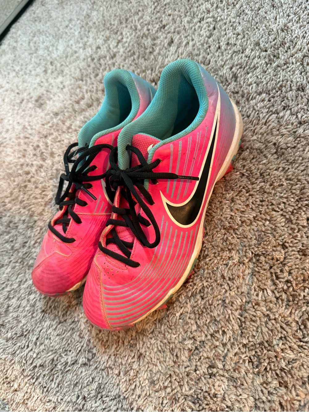 Nike Women’s Pink Athletic Cleats with Teal Lining and Black Swoosh